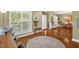 Bright foyer featuring hardwood floors, a front door, and an open view into the dining area and staircase at 1428 White Opal Dr, Knightdale, NC 27545