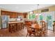 Well-equipped kitchen with stainless steel appliances, a central island, and a dining area at 1428 White Opal Dr, Knightdale, NC 27545