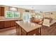 Open kitchen with stainless steel appliances, an island, and seamless flow to the dining area at 1428 White Opal Dr, Knightdale, NC 27545