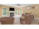 Bright living room with a cozy fireplace, comfortable seating, and neutral decor at 1428 White Opal Dr, Knightdale, NC 27545