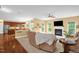 Inviting living room featuring a fireplace, plush seating, and abundant natural light at 1428 White Opal Dr, Knightdale, NC 27545