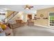 Spacious living area with comfortable seating, a staircase, and a welcoming ambiance at 1428 White Opal Dr, Knightdale, NC 27545