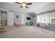 Spacious bedroom with two entrances, natural light from windows, and a cozy, open feel at 147 Gentry Dr, Pittsboro, NC 27312