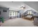 Charming bedroom with an angled ceiling, featuring a cozy bed, a desk, and natural lighting at 147 Gentry Dr, Pittsboro, NC 27312