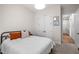 Comfortable bedroom with a bed, closet, and a doorway to a hall bathroom at 147 Gentry Dr, Pittsboro, NC 27312