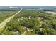 A neighborhood nestled in the woods, near a lake with single-Gathering homes surrounded by mature trees at 147 Gentry Dr, Pittsboro, NC 27312