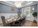 Stylish dining room with a rustic wood table, modern chairs, and elegant decor at 147 Gentry Dr, Pittsboro, NC 27312