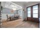 Elegant dining room features hardwood floors, wainscoting and coffered ceiling with chandelier at 147 Gentry Dr, Pittsboro, NC 27312