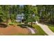 Beautiful two-story home with stone accents, a spacious driveway, and a manicured lawn at 147 Gentry Dr, Pittsboro, NC 27312