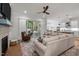 Spacious living room with a fireplace, and sliding glass doors leading to a screened deck at 147 Gentry Dr, Pittsboro, NC 27312