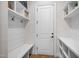 Mudroom features storage shelves, hooks, a bench, and a door at 147 Gentry Dr, Pittsboro, NC 27312