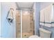 Clean, tiled shower with modern fixtures, framed with a light and bright interior at 150 Teal Dr, Youngsville, NC 27596