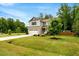 Charming two-story home with manicured lawn, attached garage and beautiful landscaping at 150 Teal Dr, Youngsville, NC 27596