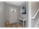 Inviting foyer featuring a decorative rug, table with decor, and a stairway at 150 Teal Dr, Youngsville, NC 27596