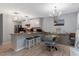 Eat-in kitchen featuring granite countertops, stainless steel appliances, and a dining area at 150 Teal Dr, Youngsville, NC 27596