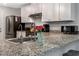Modern kitchen with granite countertops, stainless steel appliances, and ample countertop space at 150 Teal Dr, Youngsville, NC 27596