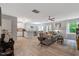 Cozy living room with wood floors and an open floor plan leading to the kitchen and dining area at 150 Teal Dr, Youngsville, NC 27596