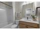 Clean bathroom featuring a shower-tub, vanity with sink, and modern fixtures at 158 Vaughan Farms Drive Dr, Angier, NC 27501