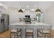 Bright kitchen featuring a large island with seating, pendant lighting, and modern finishes at 158 Vaughan Farms Drive Dr, Angier, NC 27501