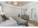 Serene main bedroom featuring a tray ceiling, stylish decor, and ensuite bathroom access at 158 Vaughan Farms Drive Dr, Angier, NC 27501