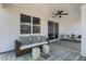 Inviting outdoor patio with comfortable seating, ceiling fan, and a stylish rug for relaxing at 158 Vaughan Farms Drive Dr, Angier, NC 27501