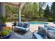 Outdoor seating area next to the pool offers comfortable lounge furniture at 16106 Morehead, Chapel Hill, NC 27517