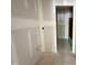 Unfinished bathroom space with stub-outs and doorway to adjacent space with a bathtub at 1701 Burnette Garden Path, Raleigh, NC 27612