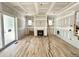 Bright living room featuring a fireplace and wood flooring waiting to be installed at 1701 Burnette Garden Path, Raleigh, NC 27612