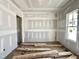 Bright room with smooth wall, window and flooring waiting to be installed at 1701 Burnette Garden Path, Raleigh, NC 27612