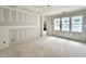 Bare walls room with flooring and three large windows at 1701 Burnette Garden Path, Raleigh, NC 27612
