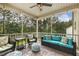 Comfortable screened-in porch with stylish seating, perfect for enjoying the outdoors at 187 Farrah-Shea Way, Angier, NC 27501