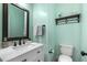 Stylish half bathroom with modern fixtures, vanity, and toilet at 187 Farrah-Shea Way, Angier, NC 27501