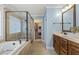 Bathroom with a soaking tub, glass shower and double vanity at 187 Farrah-Shea Way, Angier, NC 27501