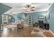 Bright bonus room with a desk, seating, and hardwood floors offers a flexible living space at 187 Farrah-Shea Way, Angier, NC 27501