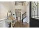 Inviting entryway with hardwood floors, console table, and a glimpse of the staircase leading to the upper level at 187 Farrah-Shea Way, Angier, NC 27501