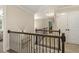 Upstairs hallway with wrought iron railing and closet at 187 Farrah-Shea Way, Angier, NC 27501