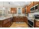 Spacious kitchen featuring granite countertops, stainless steel appliances, white subway tile and hardwood floors at 187 Farrah-Shea Way, Angier, NC 27501