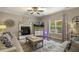 Comfortable living room featuring a fireplace, ceiling fan, and neutral color palette, perfect for relaxation at 187 Farrah-Shea Way, Angier, NC 27501