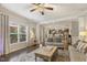 Bright living room featuring hardwood floors, recessed lighting, large windows and an open concept floorplan at 187 Farrah-Shea Way, Angier, NC 27501