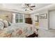 Main bedroom with trey ceilings, ceiling fan, and ensuite bathroom at 187 Farrah-Shea Way, Angier, NC 27501
