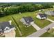Lovely aerial perspective of a home featuring a lush lawn, charming landscaping, and neighborhood in background at 206 Heart Pine Dr, Wendell, NC 27591
