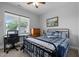 Cozy bedroom with a window view, study desk, and comfortable furnishings at 206 Heart Pine Dr, Wendell, NC 27591