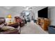 Versatile bonus room with a comfortable seating area, gym equipment, and a large TV at 206 Heart Pine Dr, Wendell, NC 27591