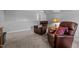 Cozy bonus room with comfortable leather chairs and soft lighting for relaxation at 206 Heart Pine Dr, Wendell, NC 27591