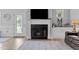 Elegant fireplace adds charm to the living area near the kitchen and dining at 206 Heart Pine Dr, Wendell, NC 27591