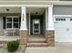 Inviting front porch features classic columns and brick accents at 206 Heart Pine Dr, Wendell, NC 27591