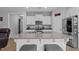 Modern kitchen with stainless steel appliances, a large island, and stylish gray countertops at 206 Heart Pine Dr, Wendell, NC 27591