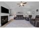 Cozy living room featuring a fireplace and ample seating at 206 Heart Pine Dr, Wendell, NC 27591