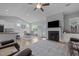 Open living space with a fireplace, kitchen island, and dining area at 206 Heart Pine Dr, Wendell, NC 27591