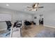 Functional office space with a ceiling fan, a desk, and a laminate floor at 206 Heart Pine Dr, Wendell, NC 27591